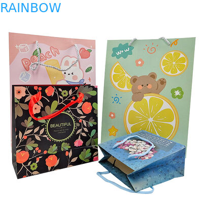 थोक कस्टम मुद्रित लोगो लक्जरी उपहार कागज बैग खुदरा बुटीक खरीदारी कागज बैग