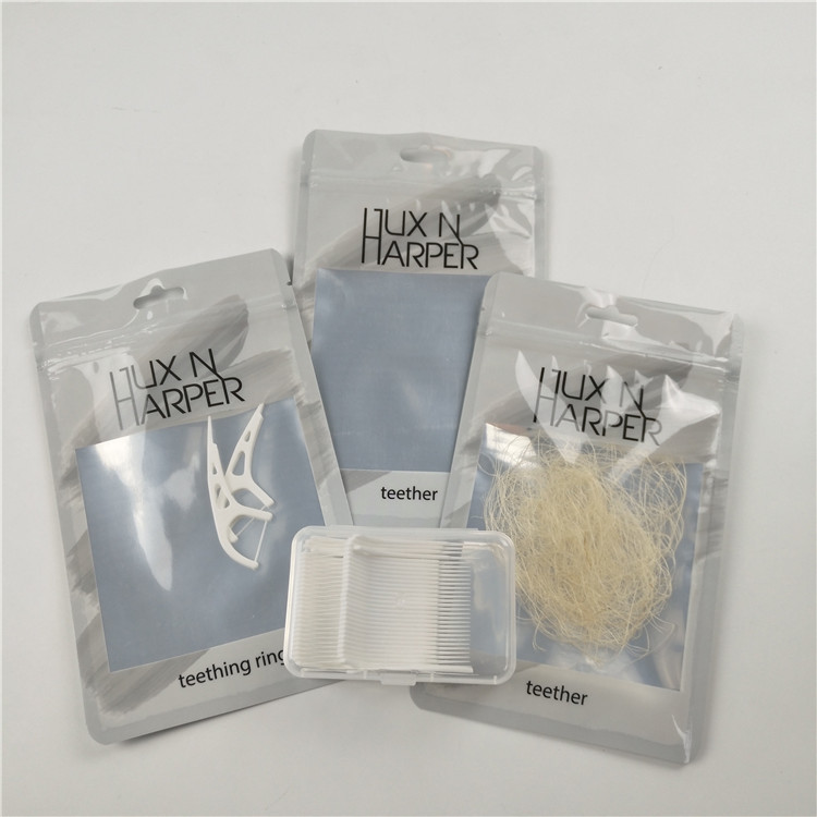 चमकदार स्पष्ट सामने दंत सोता लटका छेद प्लास्टिक बैग एल्यूमीनियम पन्नी अनुकूलित ज़िप ताला बैग पैकेजिंग है